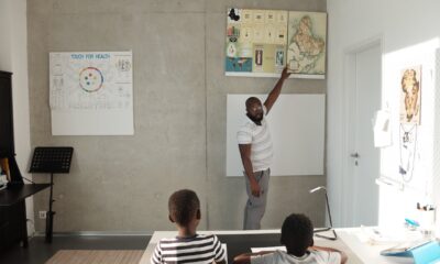 black man teacher explaining lesson to pupils