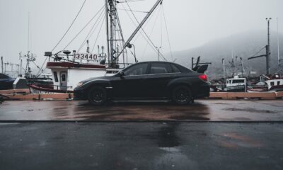 a black subaru wrx parked in the port